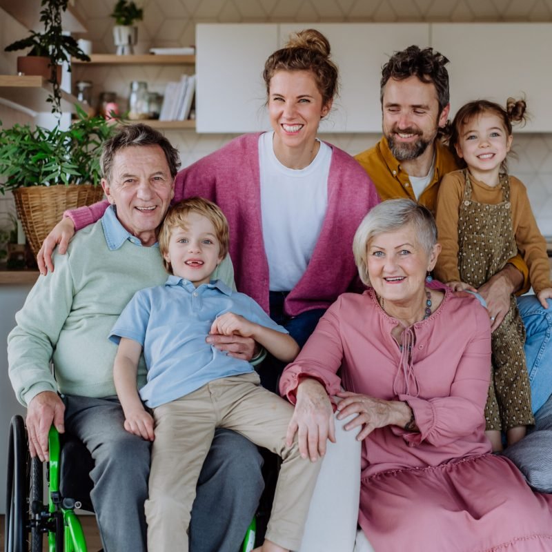 Portrait of happy multigenerational family in their three generation house.